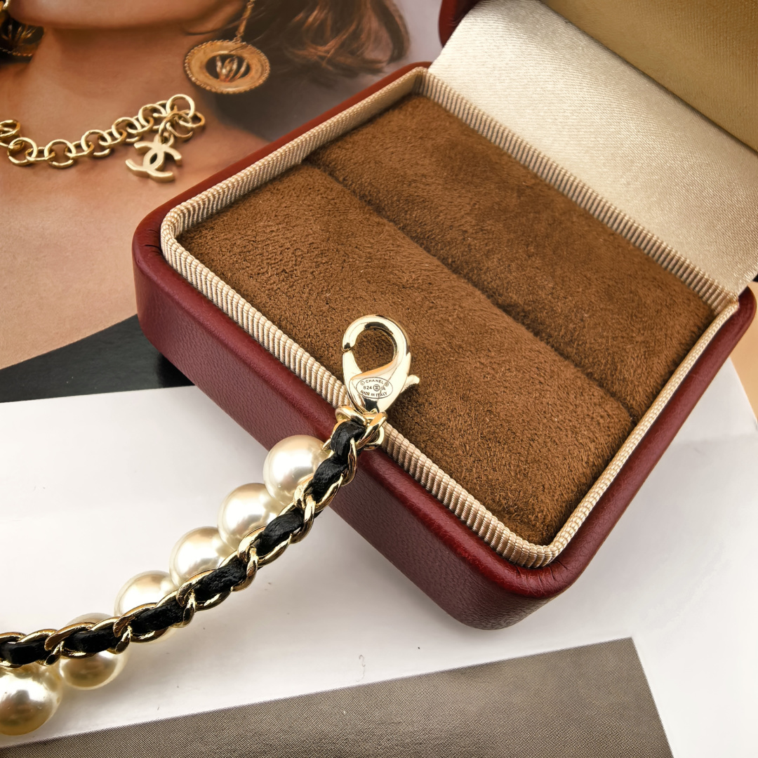 Chanel CC Logo Layered Pearl Leather Chain Necklace necklace Gold-tone metal white faux pearl black leather clear crystal 42cm