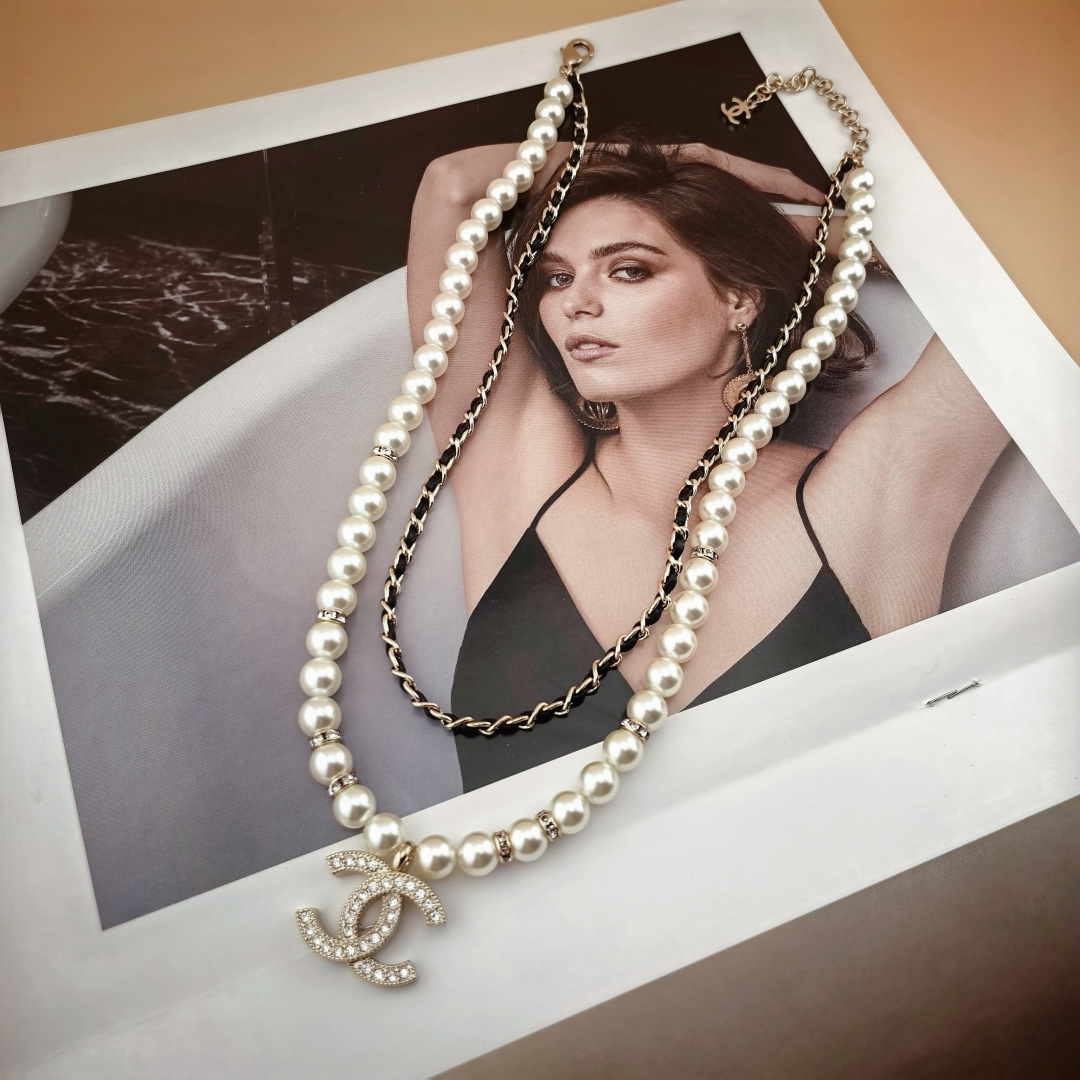 Chanel CC Logo Layered Pearl Leather Chain Necklace necklace Gold-tone metal white faux pearl black leather clear crystal 42cm