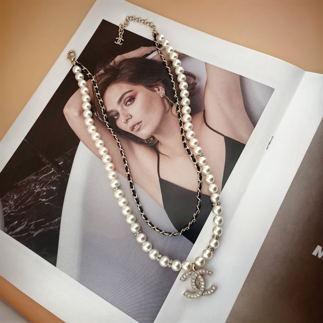 Chanel CC Logo Layered Pearl Leather Chain Necklace necklace Gold-tone metal white faux pearl black leather clear crystal 42cm