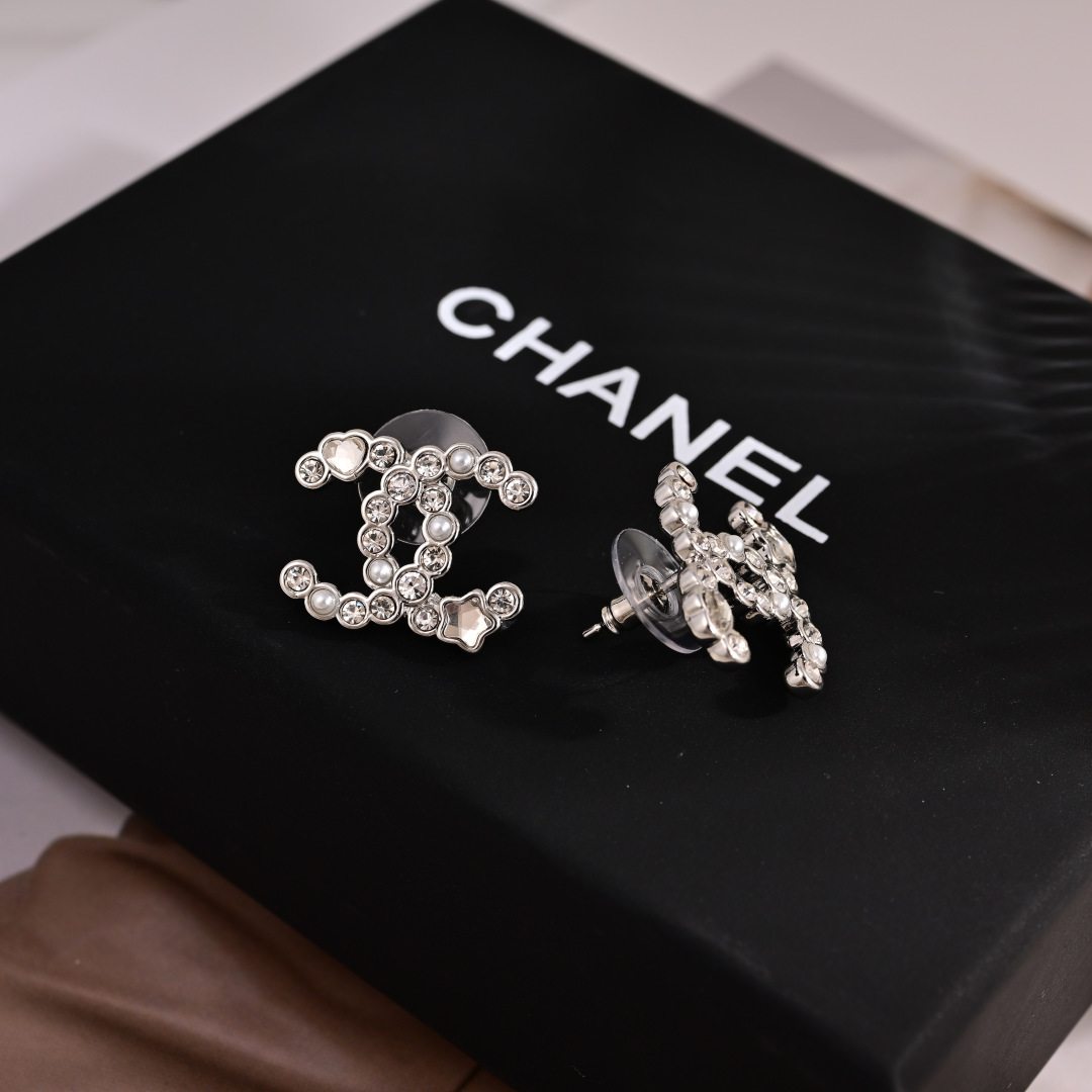 Chanel CC Logo Heart Star Crystal Pearl Stud Earrings earrings Silver-toned metal with clear crystals white faux pearls and mother-of-pearl heart and star accents 1 5cm width per earring