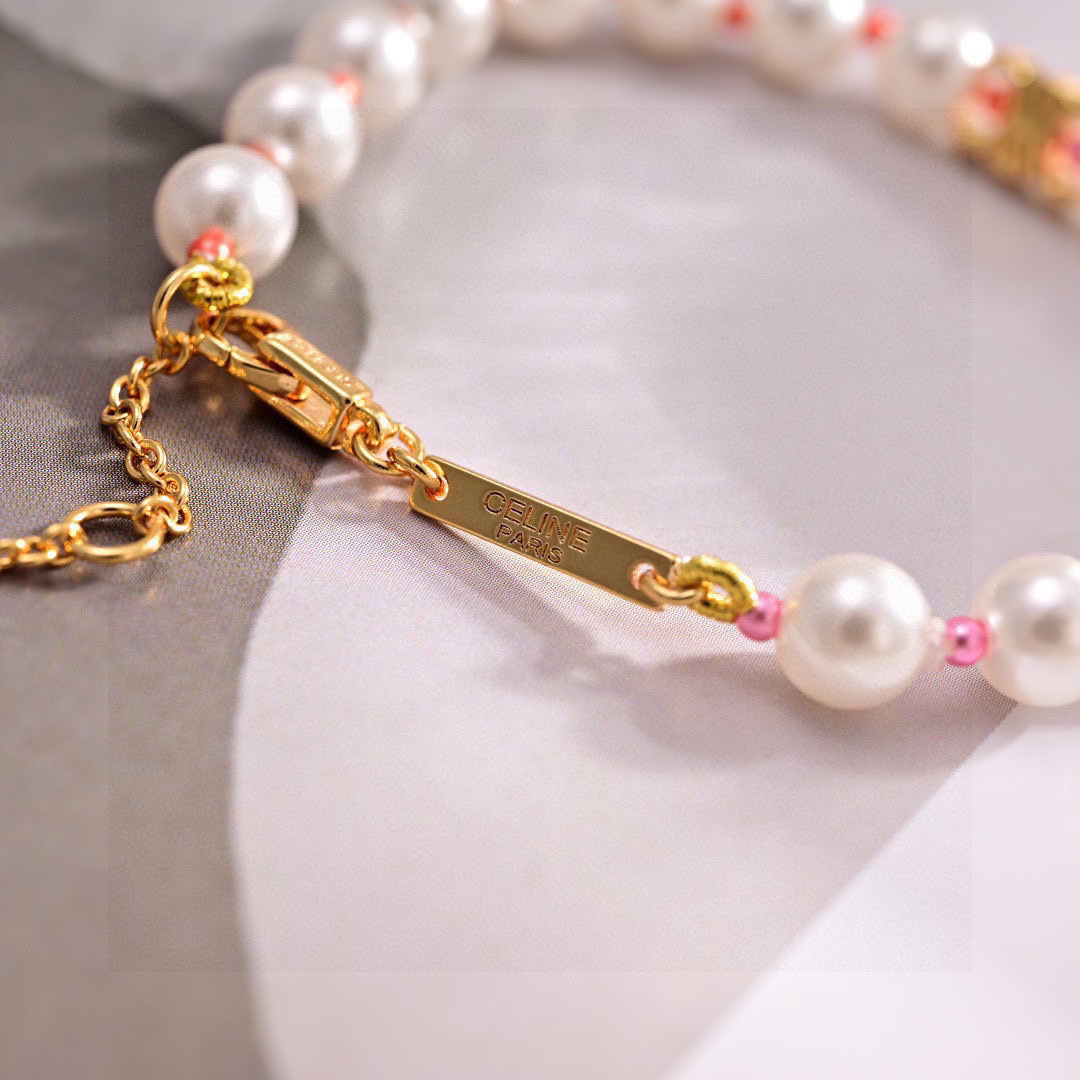 Celine Triomphe Pearl bracelet gold-tone metal white pearls pink and coral accent beads 18cm with 5cm extension chain