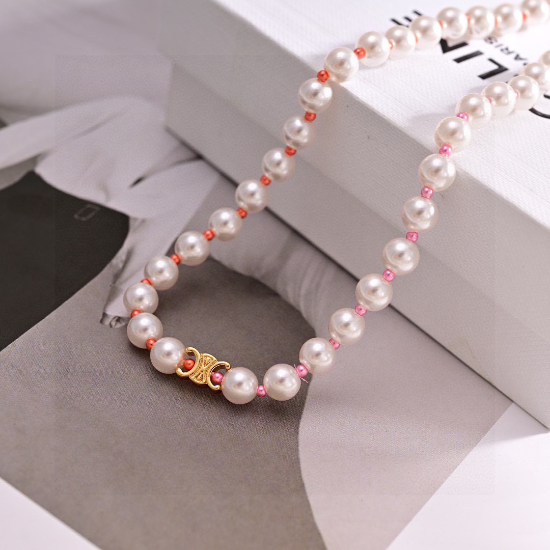 Celine Triomphe Pearl bracelet gold-tone metal white pearls pink and coral accent beads 18cm with 5cm extension chain