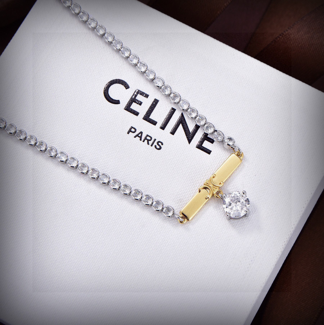 Celine Triomphe Crystal Bar Pendant necklace Two-tone silver-toned metal with gold-tone Triomphe bar clear crystal accents 40cm with 5cm extender