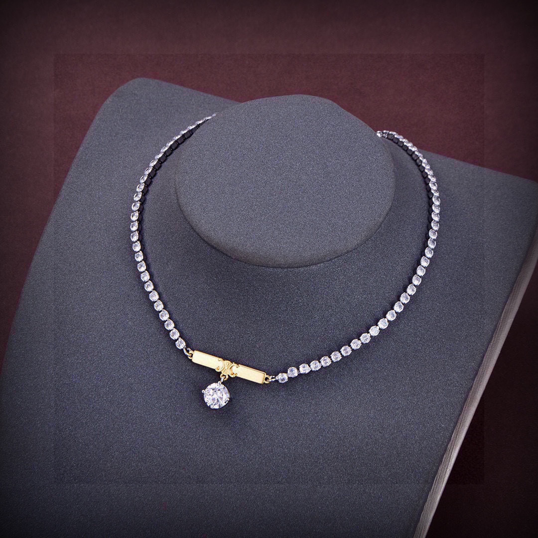 Celine Triomphe Crystal Bar Pendant necklace Two-tone silver-toned metal with gold-tone Triomphe bar clear crystal accents 40cm with 5cm extender