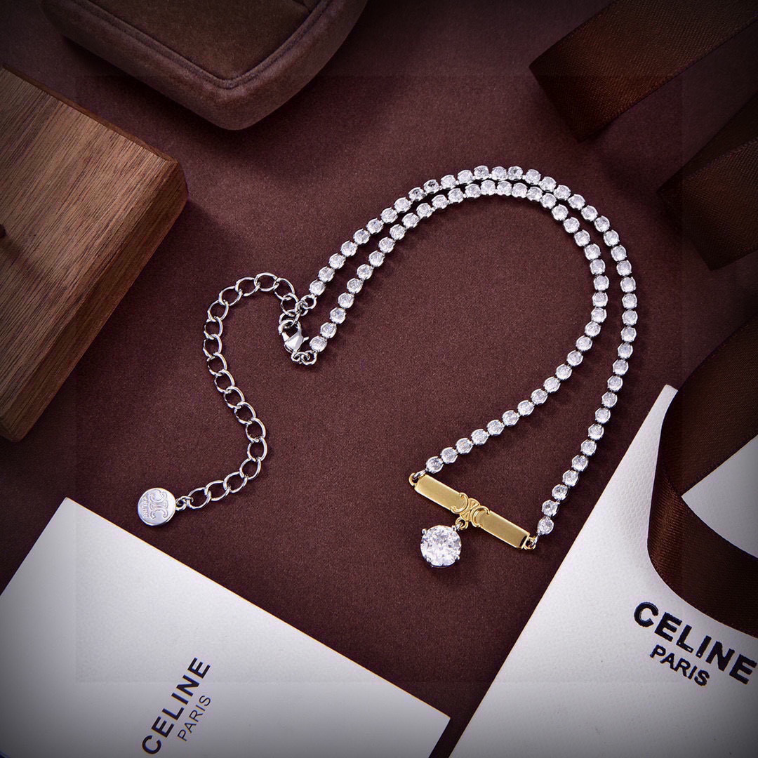 Celine Triomphe Crystal Bar Pendant necklace Two-tone silver-toned metal with gold-tone Triomphe bar clear crystal accents 40cm with 5cm extender