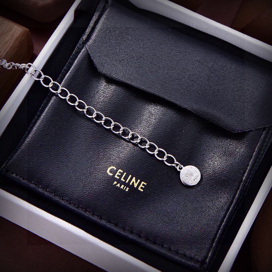 Celine Triomphe Crystal Bar Pendant necklace Two-tone silver-toned metal with clear crystal stones and gold-toned Triomphe bar accent 40cm with 5cm extender chain