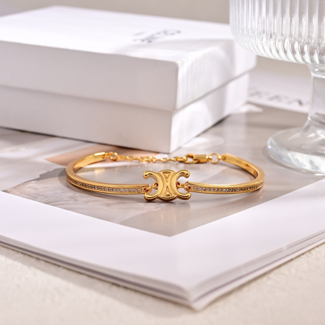 Celine Triomphe Sparkle bracelet gold-tone brass with clear crystal accents adjustable chain