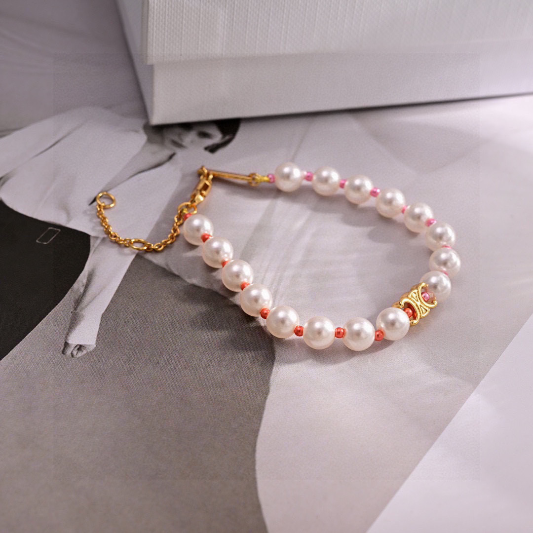 Celine Triomphe Pearl bracelet gold-tone metal white pearls pink and coral accent beads 18cm with 5cm extender chain