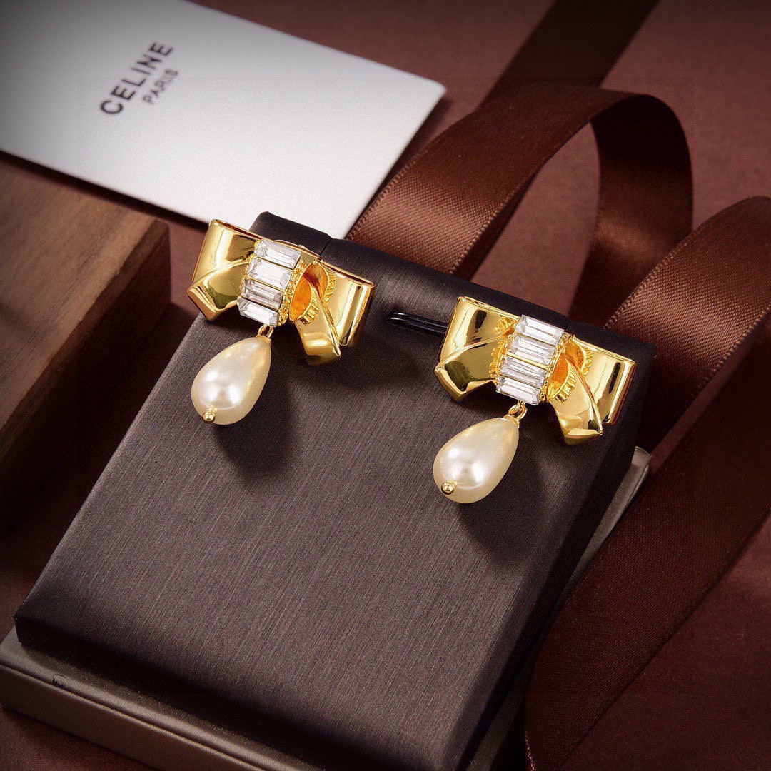 Celine Chic Bow Pearl Drop earrings gold-tone metal clear baguette-cut crystals cream teardrop faux pearl 3 2cm drop length