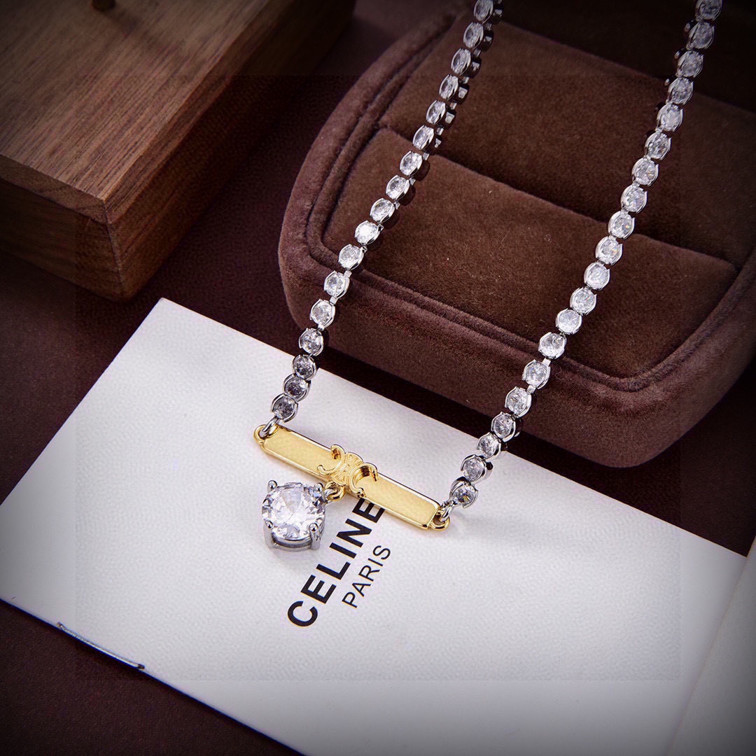 Celine PRECLOUS Triomphe Crystal Pendant Necklace necklace Two-tone silver-toned metal with clear crystal stones gold-toned Triomphe bar accent 40cm with 5cm extender chain