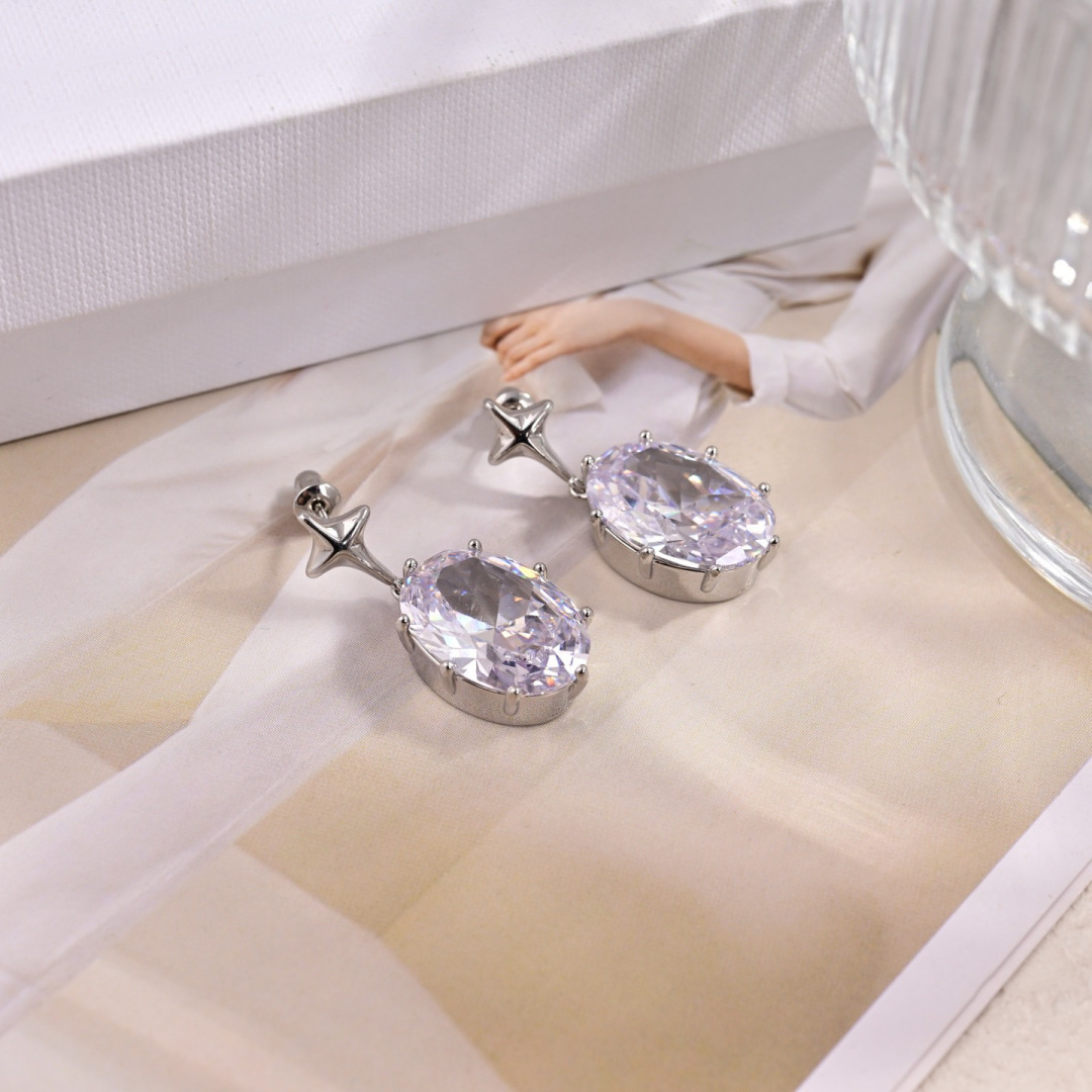 Celine Star Drop Oval Crystal earrings silver-toned metal with clear faceted crystal 2 5cm drop length