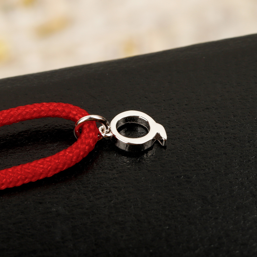 Qeelin Wulu Mini Solitaires bracelet Red cord with 18K gold rose gold white gold options and clear diamond accents Adjustable sliding knot fits 15-19cm wrist