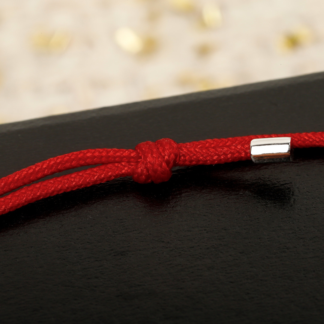 Qeelin Wulu Mini Solitaires bracelet Red cord with 18K gold rose gold white gold options and clear diamond accents Adjustable sliding knot fits 15-19cm wrist