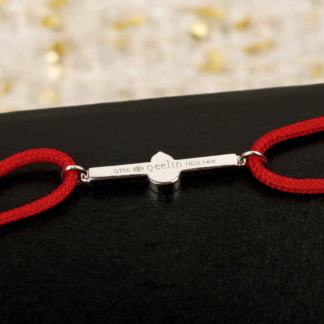 Qeelin Wulu Mini Solitaires bracelet Red cord with 18K gold rose gold white gold options and clear diamond accents Adjustable sliding knot fits 15-19cm wrist