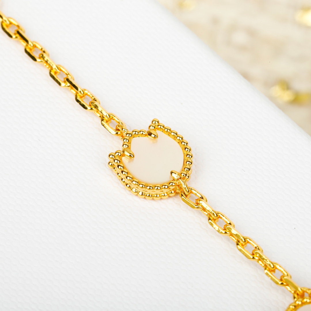 Van Cleef Arpels Lucky Alhambra bracelet 18k yellow gold white mother-of-pearl blue lapis lazuli green malachite 18cm