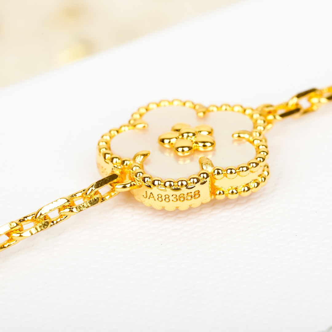 Van Cleef Arpels Lucky Alhambra bracelet 18k yellow gold white mother-of-pearl blue lapis lazuli green malachite 18cm