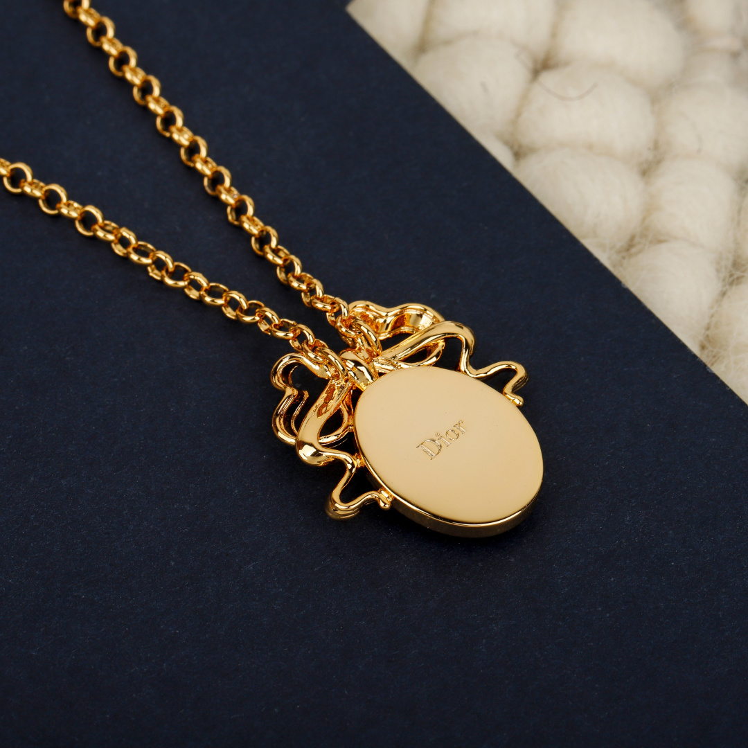 Dior 2021 New Year Bow Oval Pendant bracelet gold-tone metal no accent stones 18cm with 3cm extender