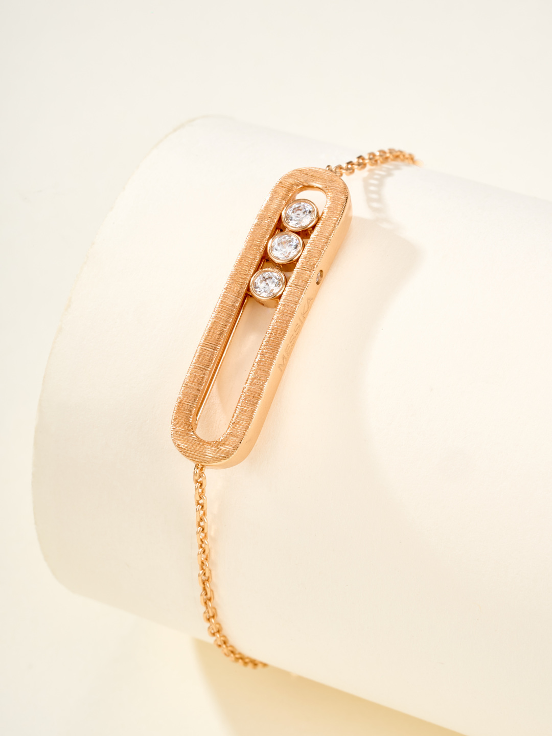 Messika Baby Move bracelet available in brushed silver-tone metal with clear round stones and brushed rose gold-tone metal with clear round stones adjustable 16-19cm