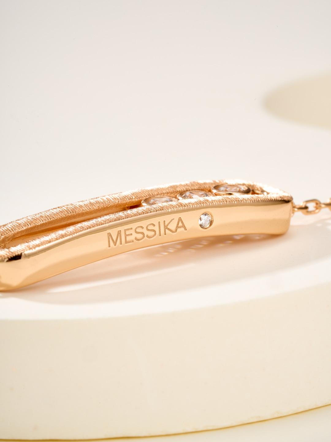 Messika Baby Move bracelet available in brushed silver-tone metal with clear round stones and brushed rose gold-tone metal with clear round stones adjustable 16-19cm