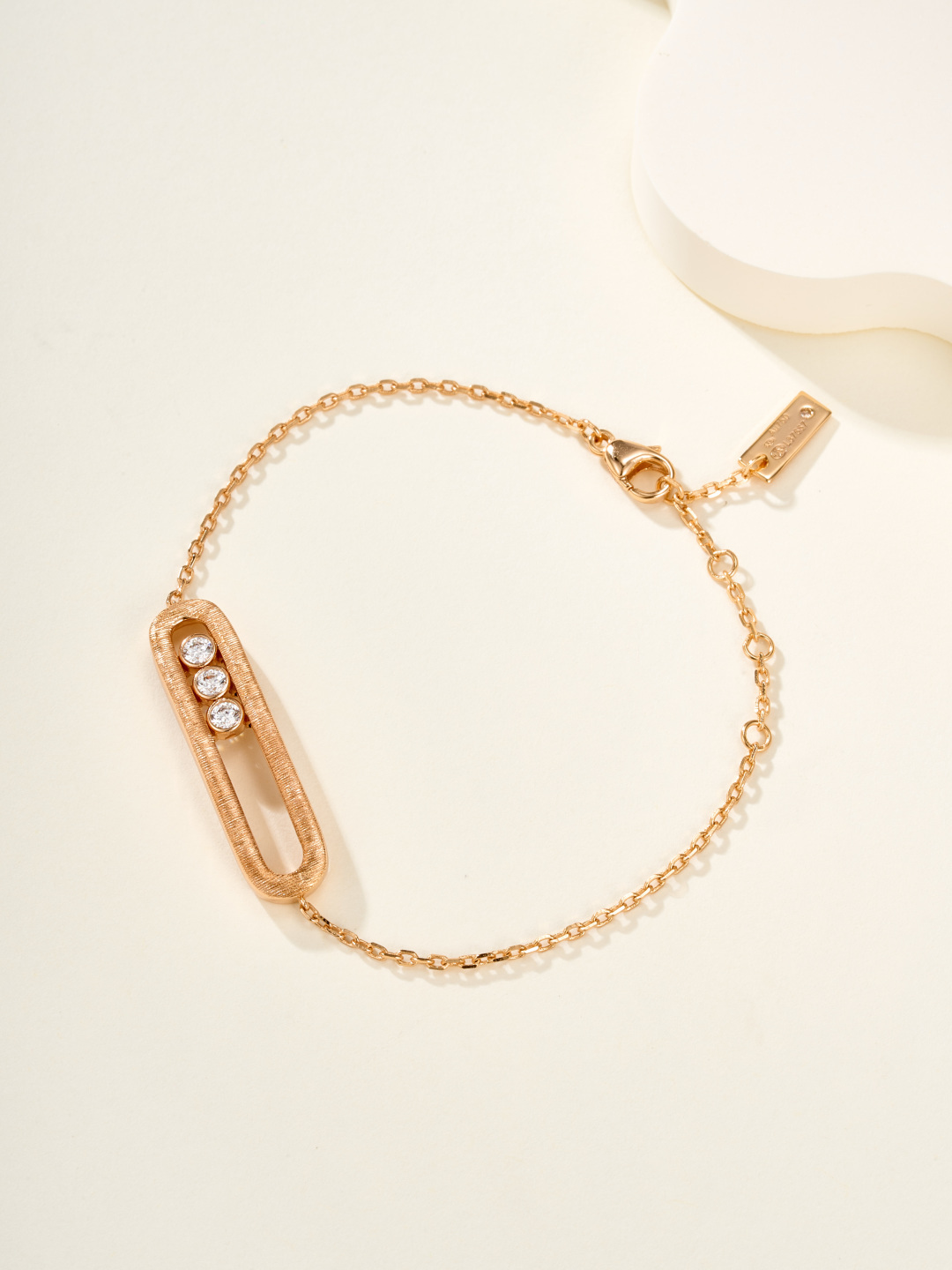 Messika Baby Move bracelet available in brushed silver-tone metal with clear round stones and brushed rose gold-tone metal with clear round stones adjustable 16-19cm