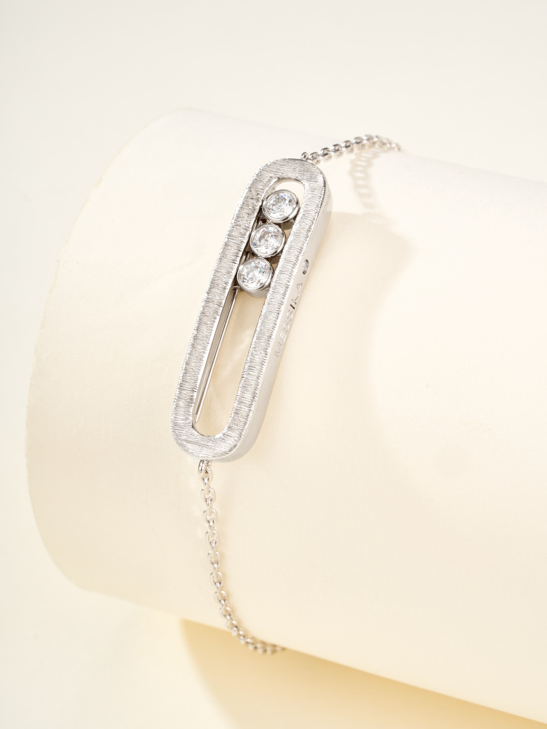 Messika Baby Move bracelet available in brushed silver-tone metal with clear round stones and brushed rose gold-tone metal with clear round stones adjustable 16-19cm