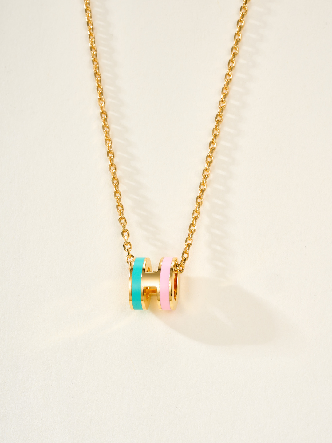 Collana Hermes Mini Pop H Rocabar metallo oro rosa con smalto bianco e marrone 40 cm