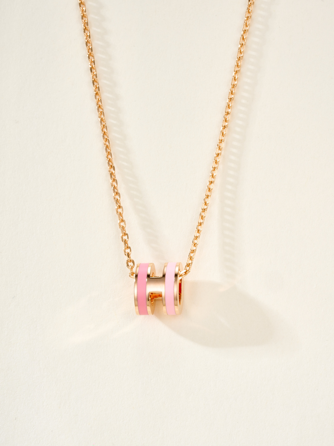 Collana Hermes Mini Pop H Rocabar metallo oro rosa con smalto bianco e marrone 40 cm