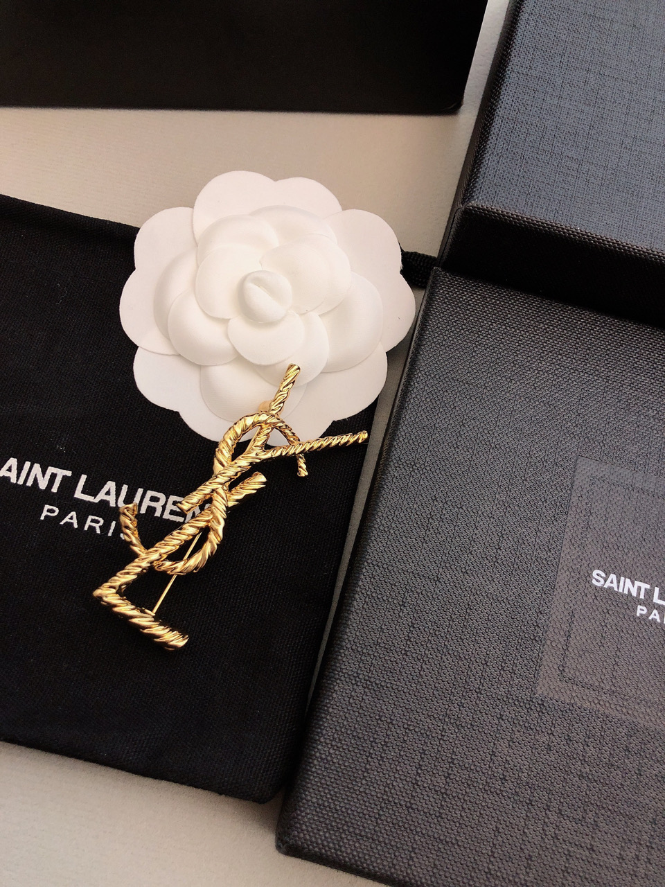 Saint Laurent Cassandre Twisted Monogram Brooch brooch gold-tone metal no accent stones 4 5cm width