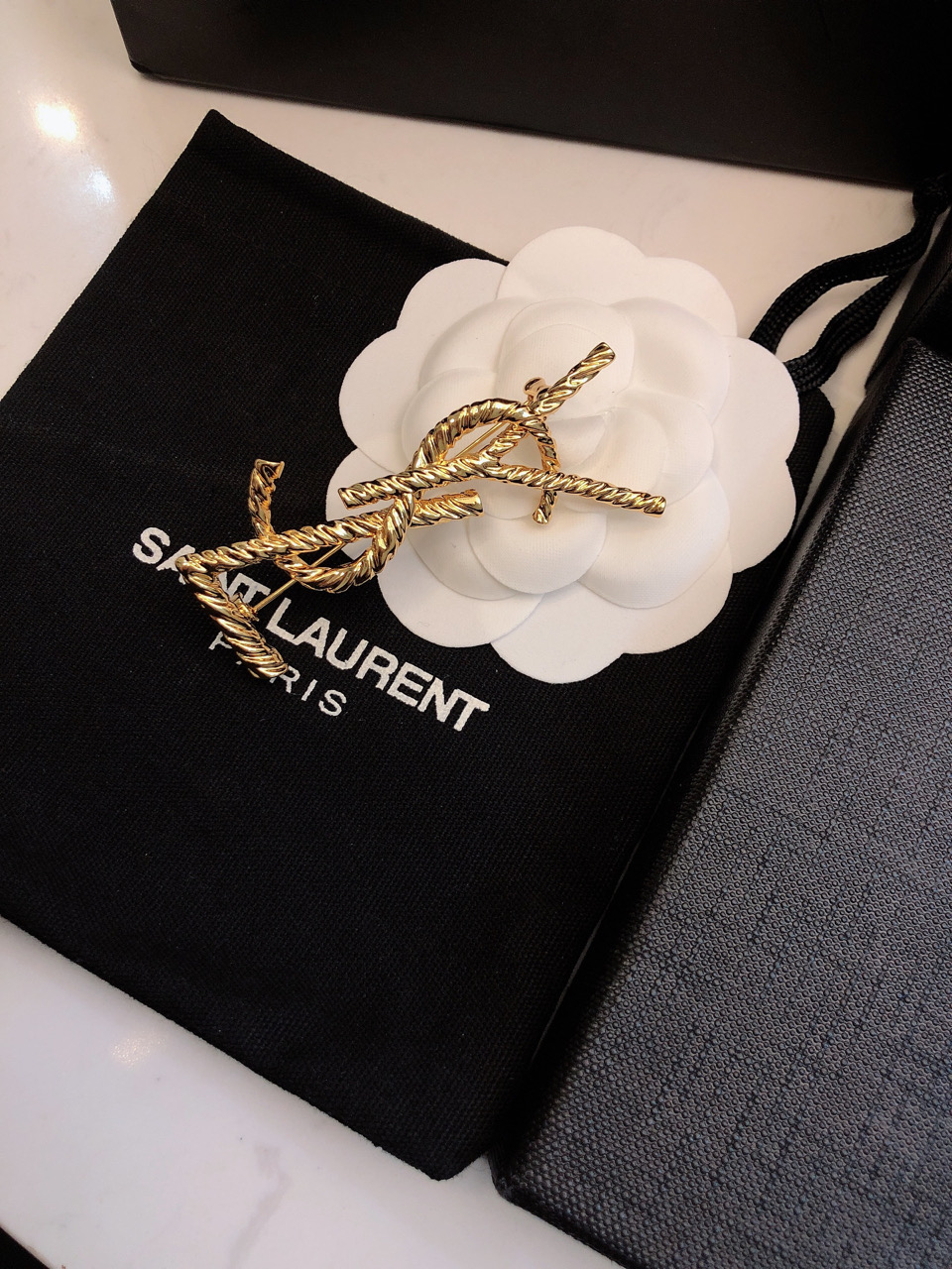Saint Laurent Cassandre Twisted Monogram Brooch brooch gold-tone metal no accent stones 4 5cm width