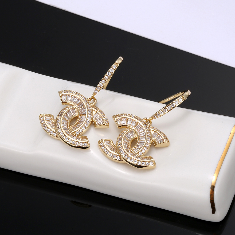 Chanel CC Baguette Crystal Drop Earrings earrings Gold-toned metal with clear baguette and round-cut crystals 2 5cm total drop length