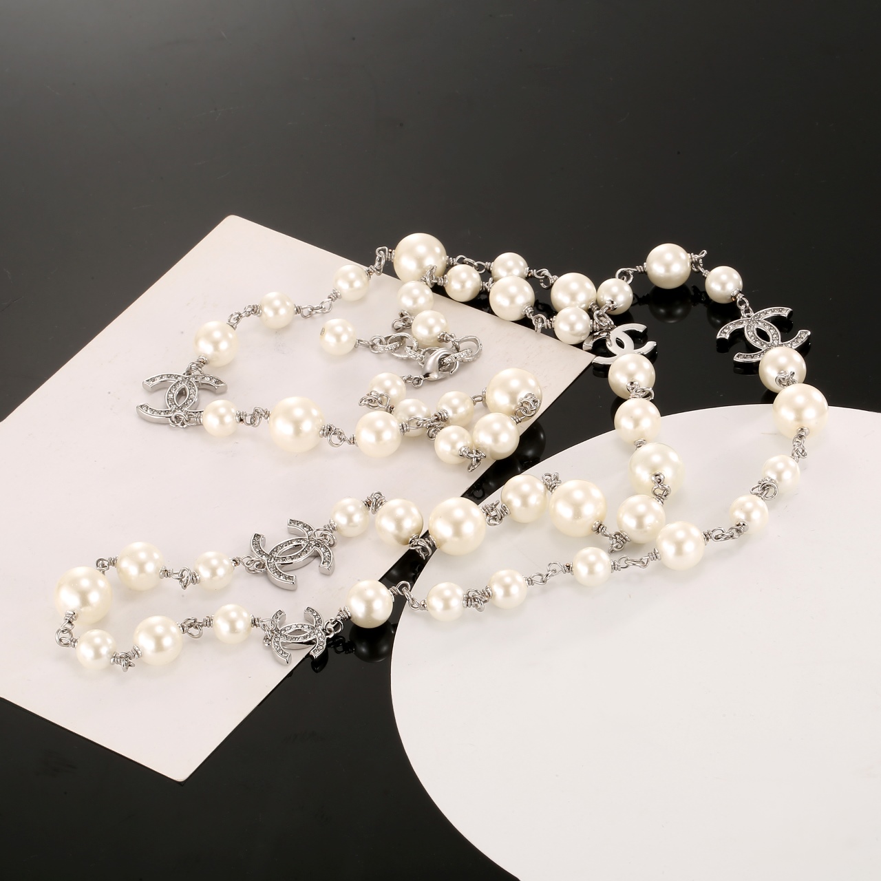 Chanel CC Logo Graduated Pearl Long Necklace necklace Silver-toned metal cream white faux pearls clear crystal accents 80cm