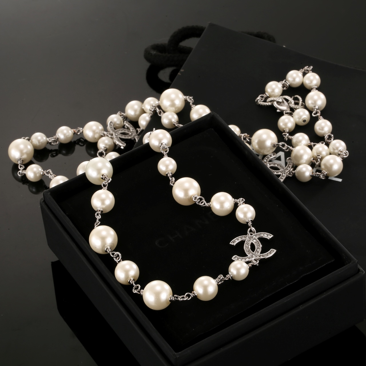 Chanel CC Logo Graduated Pearl Long Necklace necklace Silver-toned metal cream white faux pearls clear crystal accents 80cm