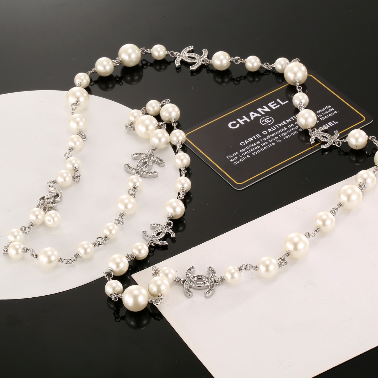 Chanel CC Logo Graduated Pearl Long Necklace necklace Silver-toned metal cream white faux pearls clear crystal accents 80cm