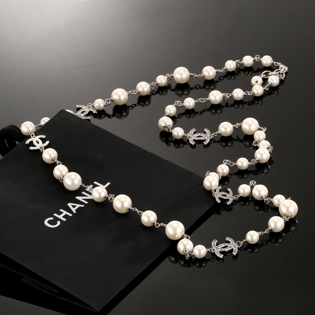 Chanel CC Logo Graduated Pearl Long Necklace necklace Silver-toned metal cream white faux pearls clear crystal accents 80cm