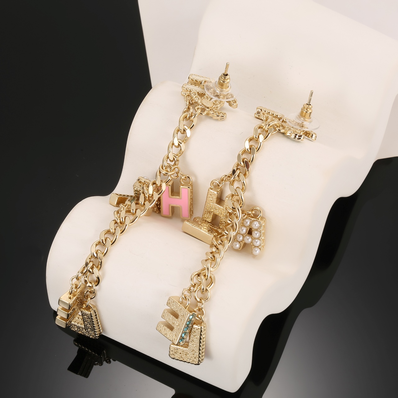 Chanel CHANEL Letter Charm CC Drop Earrings earrings Gold-tone metal with green crystals white faux pearls cream pink yellow and pink enamel letter charms 8cm drop length