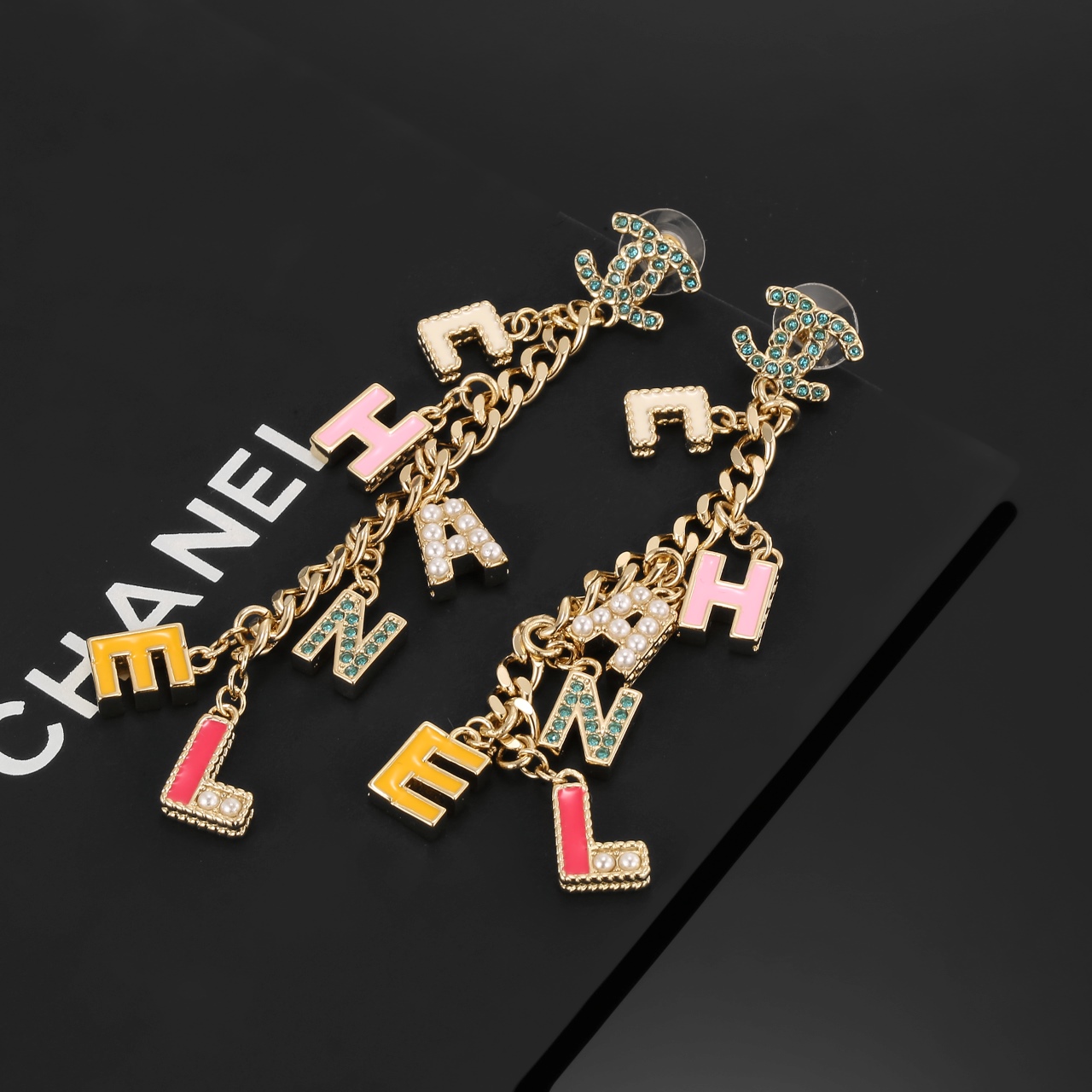 Chanel CHANEL Letter Charm CC Drop Earrings earrings Gold-tone metal with green crystals white faux pearls cream pink yellow and pink enamel letter charms 8cm drop length