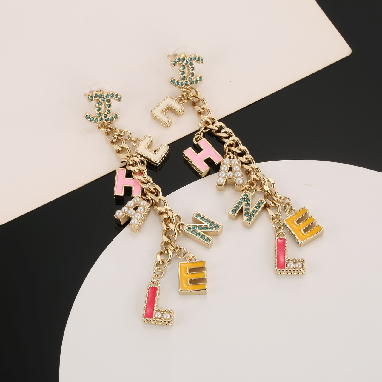 Chanel CHANEL Letter Charm CC Drop Earrings earrings Gold-tone metal with green crystals white faux pearls cream pink yellow and pink enamel letter charms 8cm drop length